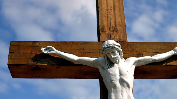 CRUCIFIX AGAINST BLUE SKY