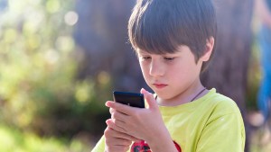 LITTLE BOY ON SMARTPHONE