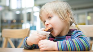 LITTLE GIRL WITH DONUT