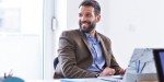 MAN WORKING AT DESK
