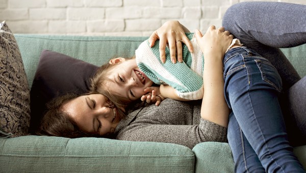 MOM AND DAUGHTER ON COUCH