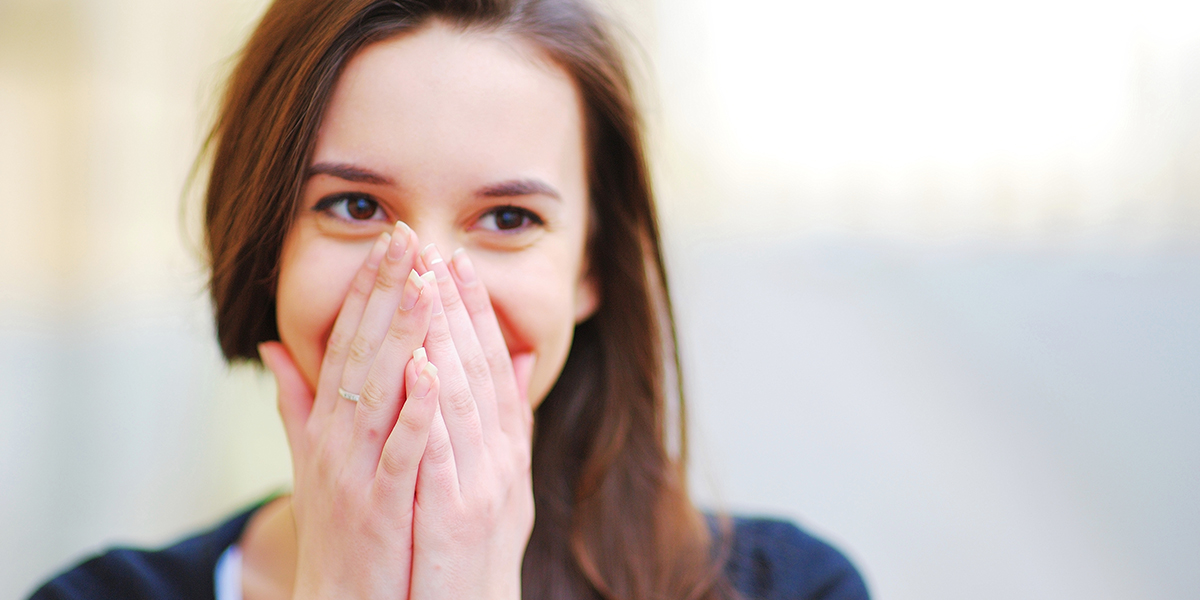 web3-woman-shy-shame-smile-sun-ok-shutterstock