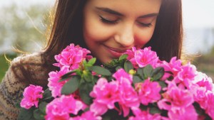 Woman smelling flowers