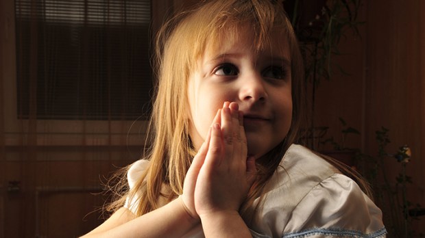 YOUNG GIRL PRAYING