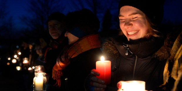 CANDLELIGHT VIGIL WOMAN