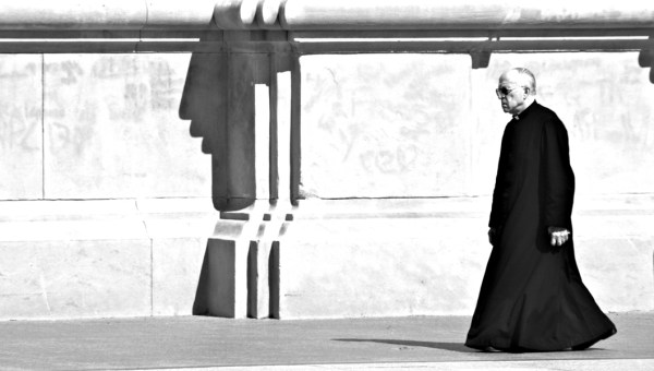 PRIEST WALKING