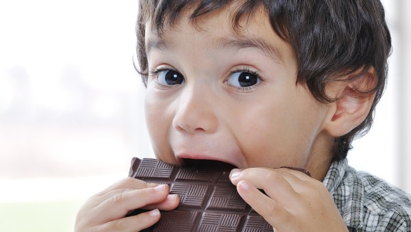 LITTLE BOY EATING CHOCOLATE