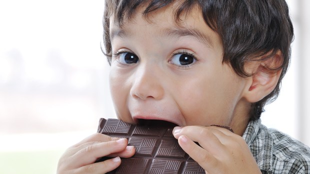 LITTLE BOY EATING CHOCOLATE