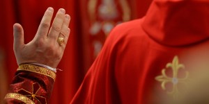 Why do priests wear red on Pentecost?