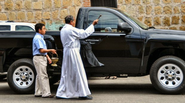 PRIEST BLESSING CAR