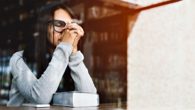 WOMAN PRAYING