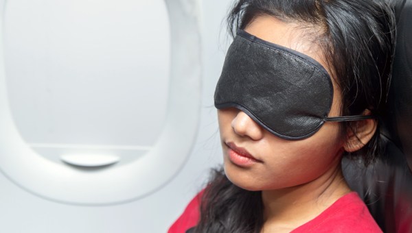 WOMAN,SLEEPING,AIRPLANE