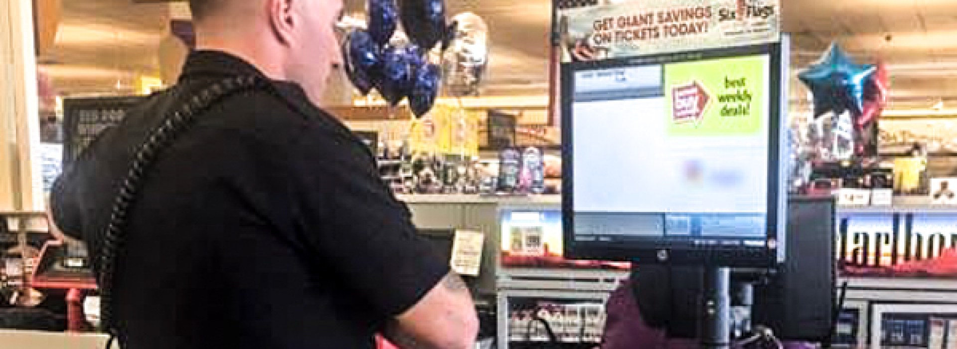 POLICE OFFICER BUYING DIAPERS, GROCERY STORE