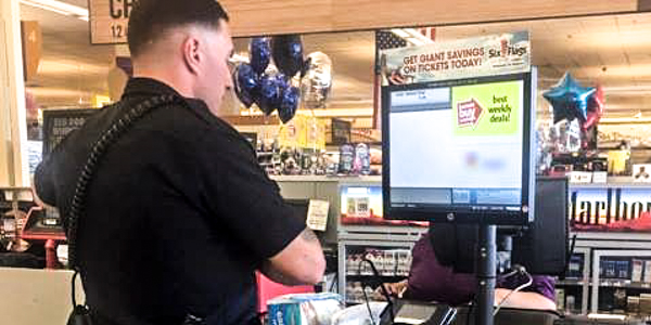 POLICE OFFICER BUYING DIAPERS, GROCERY STORE