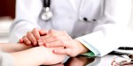 DOCTOR HOLDING PATIENTS HANDS