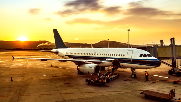 AIRPLANE ON RUNWAY,SUNSET