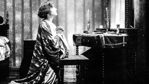 WOMAN PLEADING IN FRONT OF MIRROR