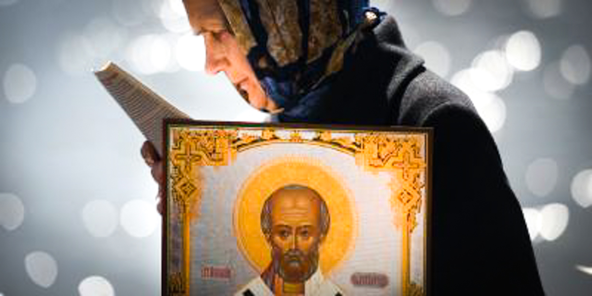 WOMAN HOLDING ICON,ST NICHOLAS