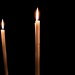 Why do Catholics light votive candles?