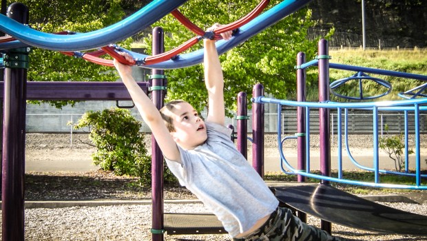 KID ON PLAYGROUND