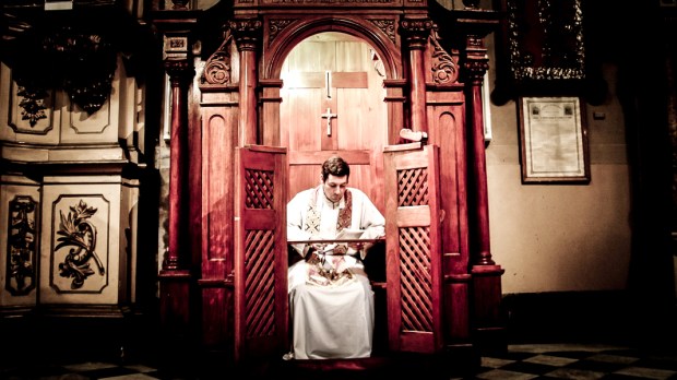 PRIEST IN CONFESSIONAL