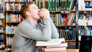 STUDENT PRAYING,LIBRARY