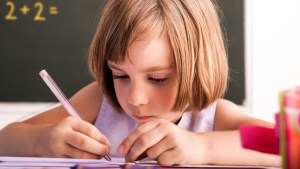 YOUNG STUDENT AT DESK