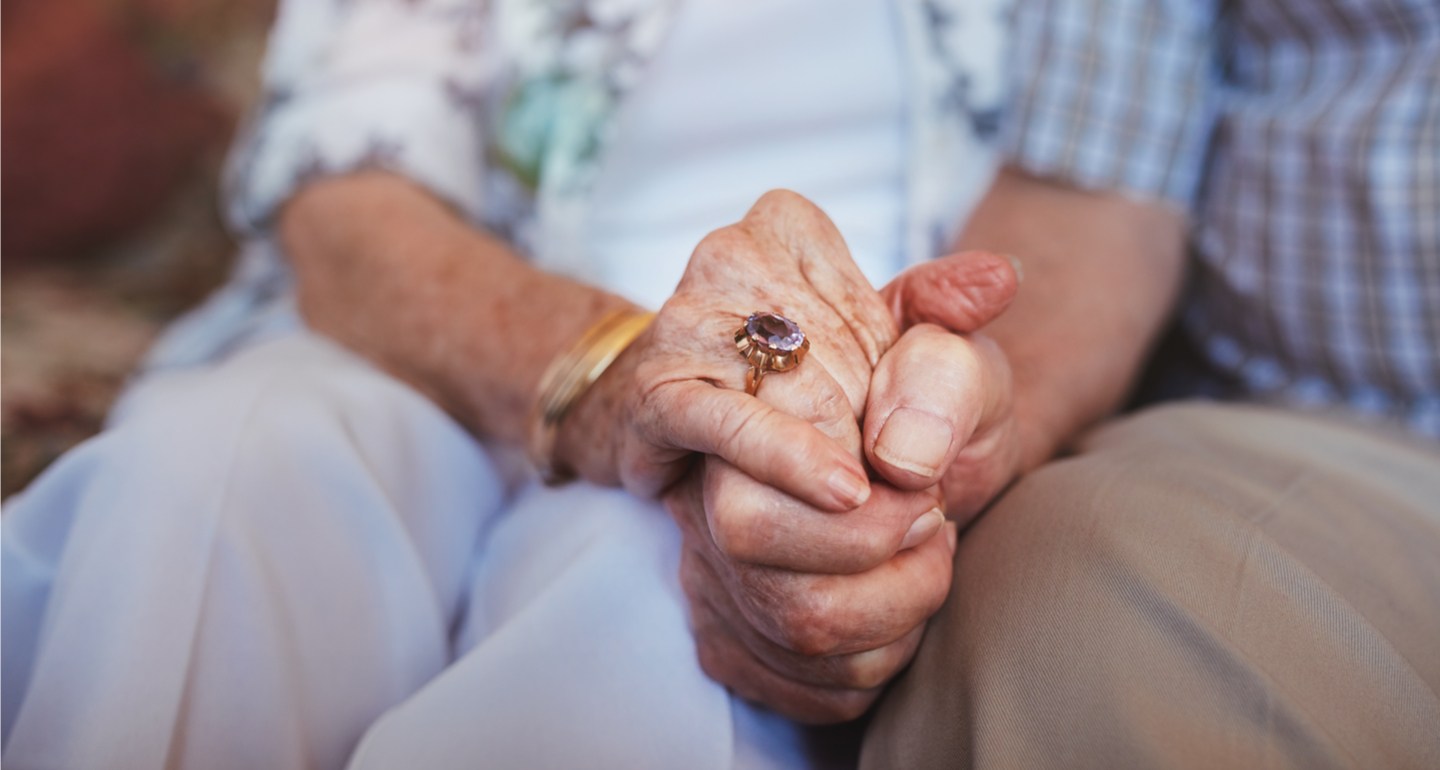 OLD COUPLE HAND IN HAND
