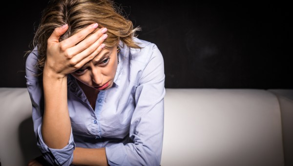 ANXIOUS WOMAN SITTING