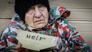 POOR WOMAN WITH HELP SIGN