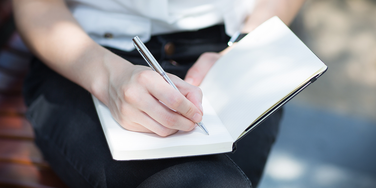 Woman writing Notes