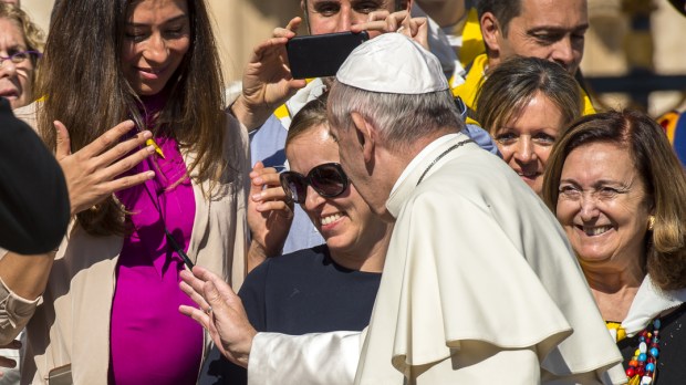 Pope Francis blessing the belly of a pregnant woman, October 05,