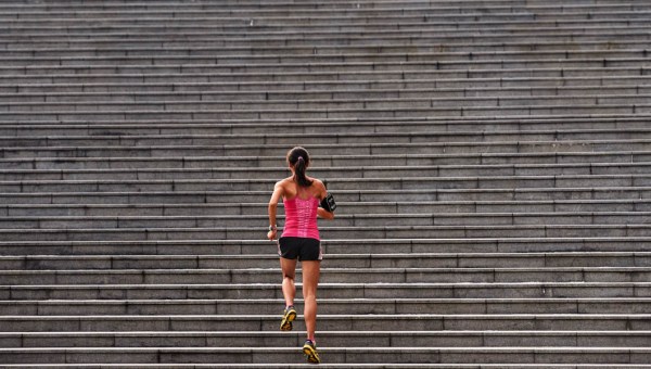 WOMAN RUNNING STAIRS