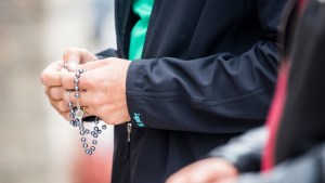 MAN,HANDS,PRAYING,ROSARY