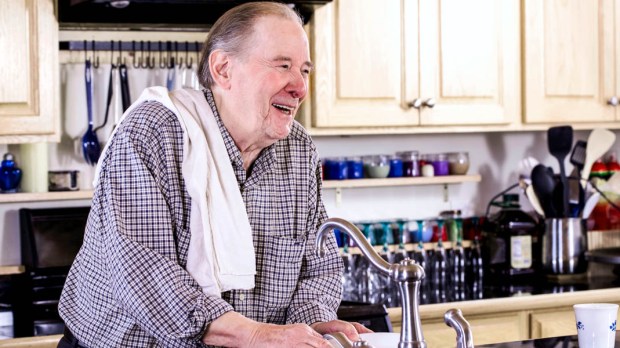 MAN CLEANING DISHES