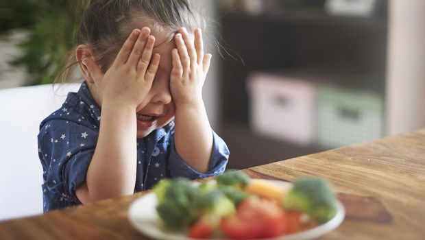 Girl eating Veggies