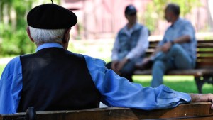 MAN SITTING ALONE