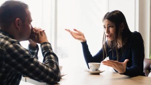 WOMAN AND MAN CONVERSING