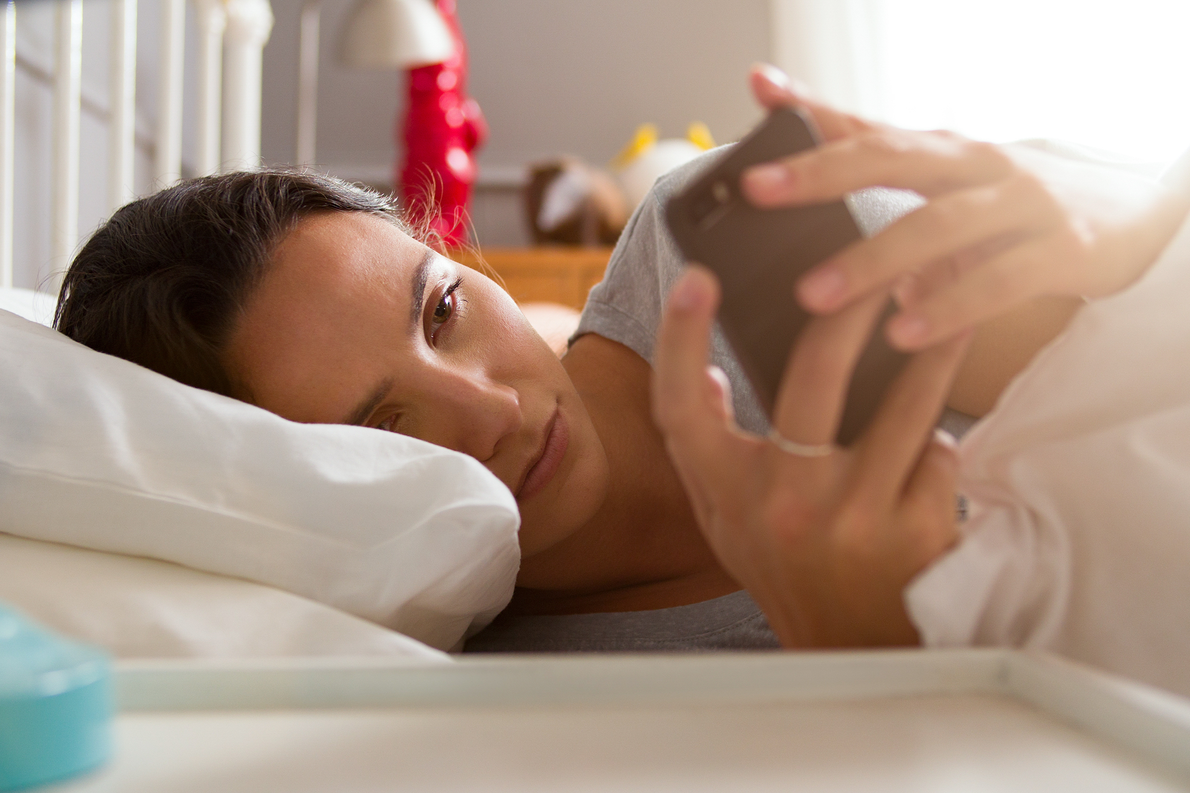 WOMAN,BED,PHONE