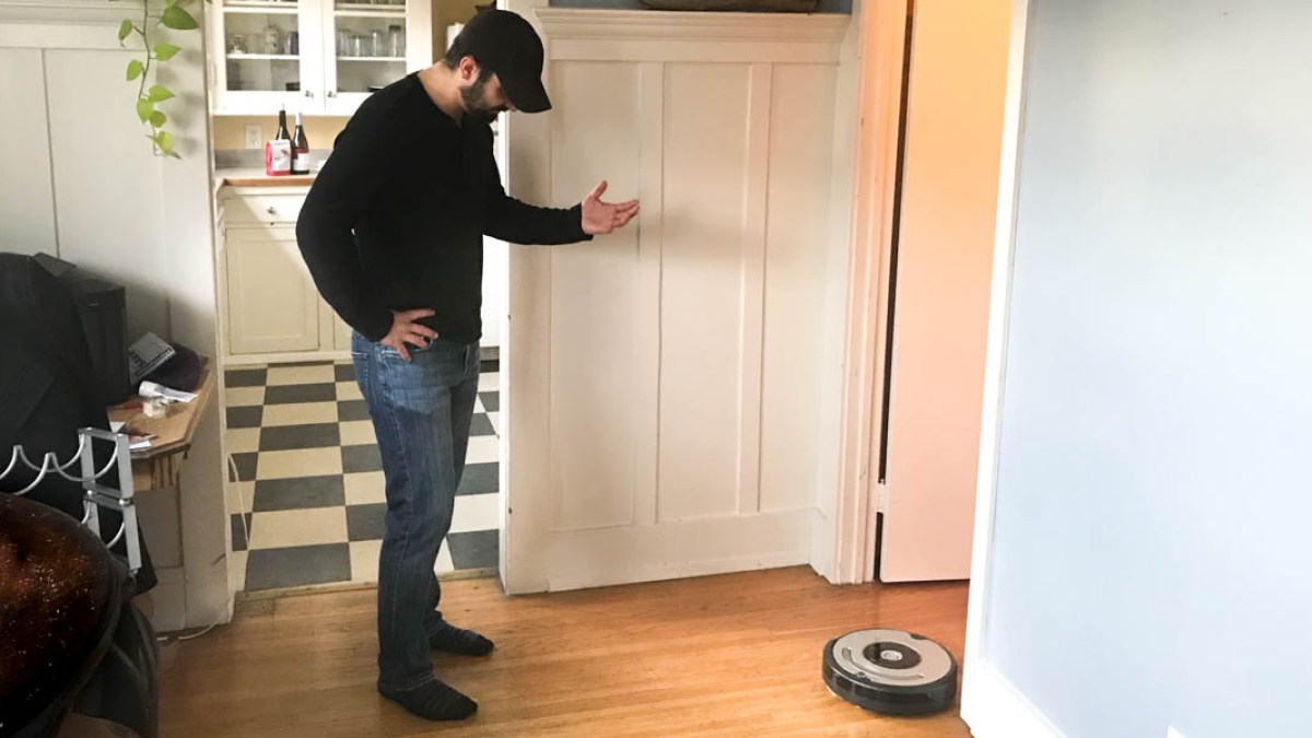MAN TALKING TO ROBOT