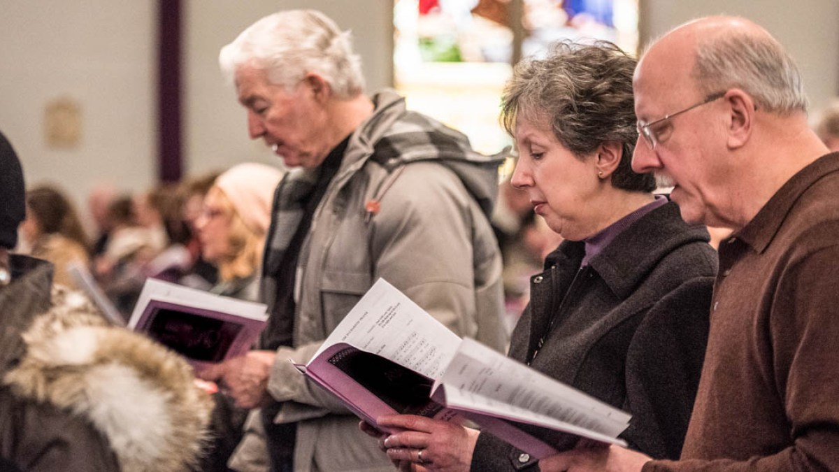 PEOPLE ATTENDING MASS
