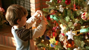 LITTLE,BOY,DECORATES,CHRISTMAS,TREE