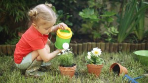 WEB3 LITTLE GIRL GARDEN WORK FLOWERS