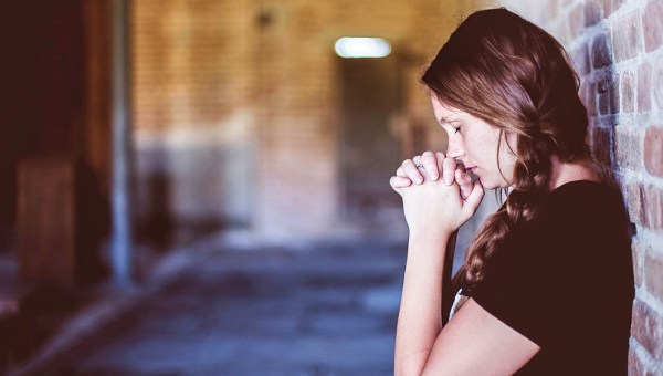 WOMAN PRAYING