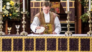 PRIEST WEARING VESTMENT