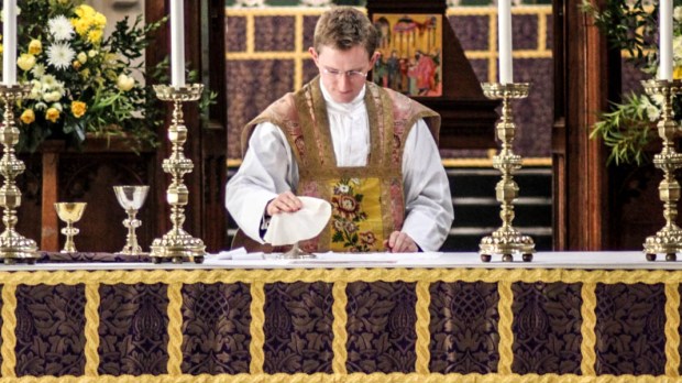 PRIEST WEARING VESTMENT