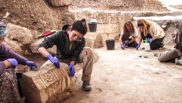 WOMAN WORKING ON STONES