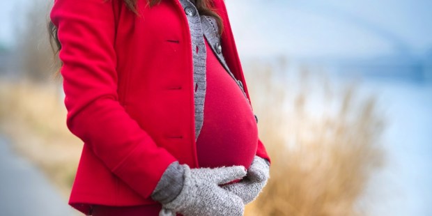 Pregnant woman in winter
