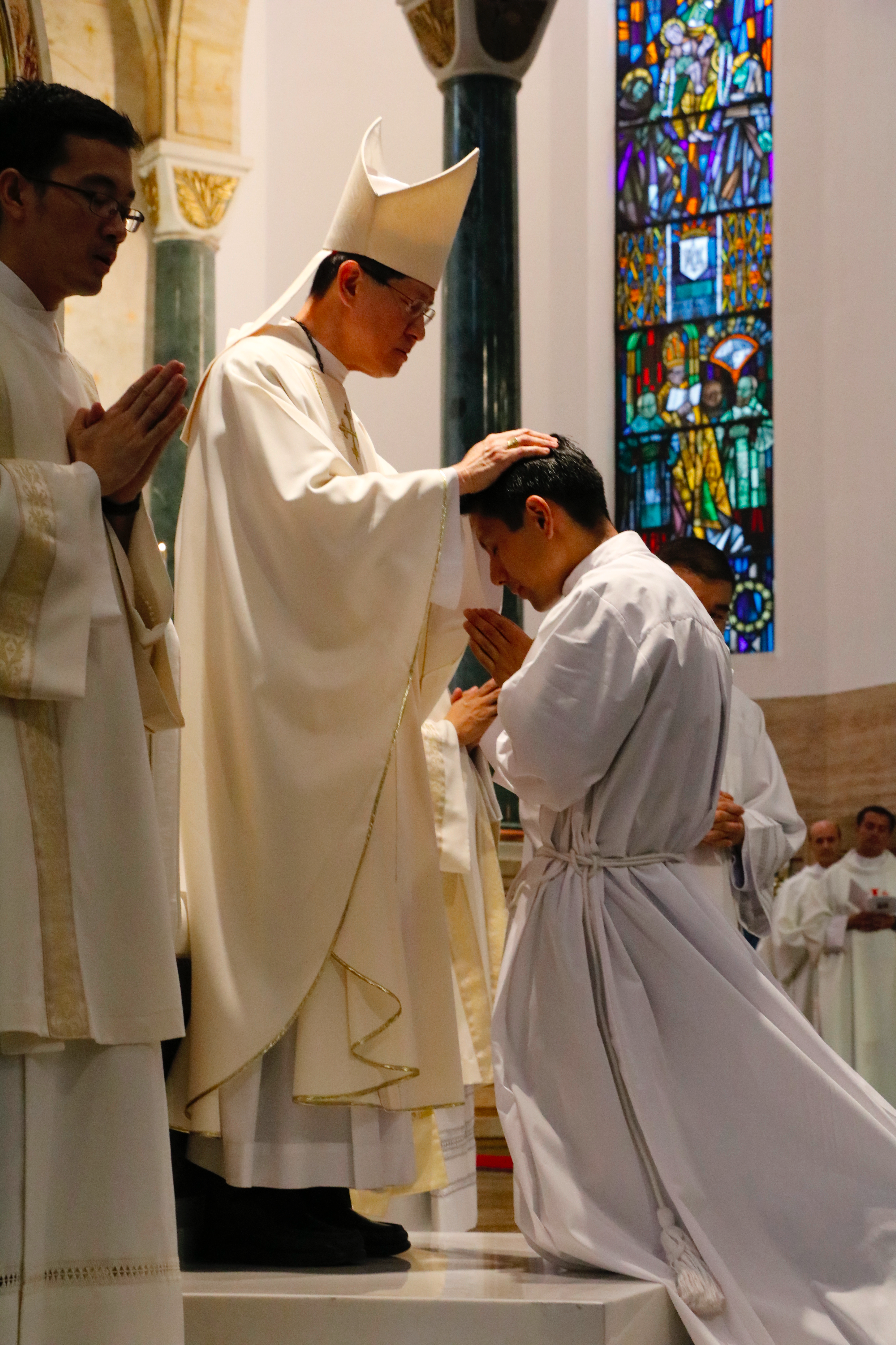 CARDINAL LAYING OF HANDS