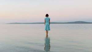 WOMAN STANDING ALONE